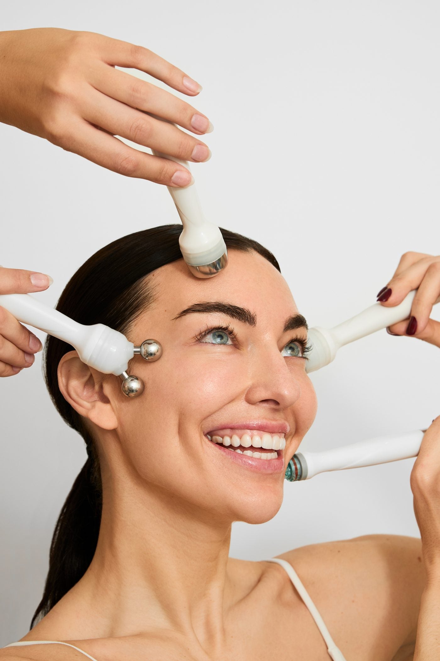 Woman smiling during a Flash Facial treatment